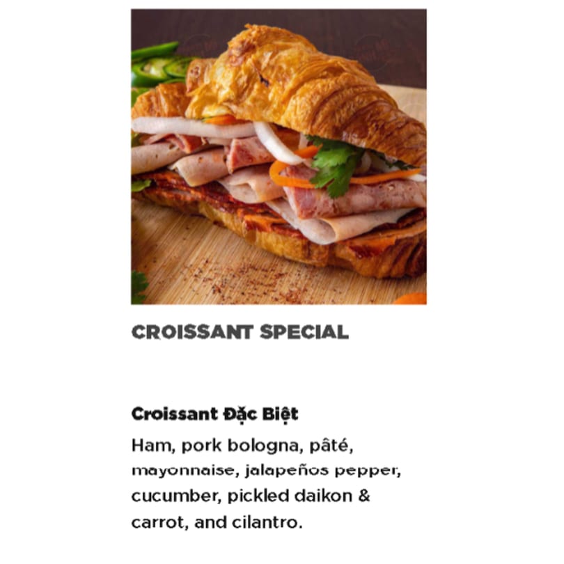 A Vietnamese Croissant Đặc Biệt with ham, pork bologna, pâté, and pickled vegetables.